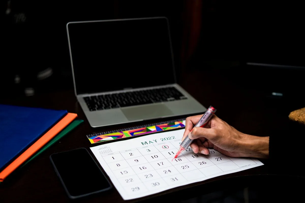 A hand marking a date on a calendar — an AI receptionist for law firms books real consultations directly into the firm's schedule
